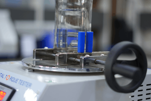 Adhesive Test on Capsulated Stoppers in Wines and spirits